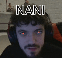 a man wearing headphones with red eyes and the word nani on his head