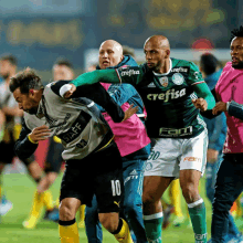 two soccer players with crefisa on their jerseys are fighting