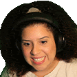 the woman is wearing headphones and smiling .