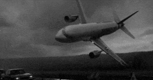 a black and white photo of an airplane that says atlantis on it