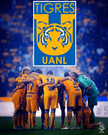 a group of soccer players are huddled together in front of a sign that says tigres uanl