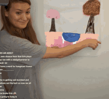 a woman is pointing at a drawing that says " ed an adult " on it