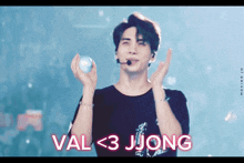 a man holding a ball with the words val < 3 jjong written above him