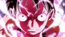 a close up of monkey d luffy 's face from one piece with a red painted face .