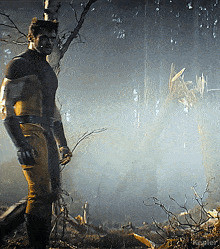 a man in a superhero costume stands in the woods