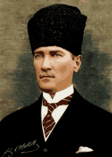 a man with a mustache wearing a black hat and a red tie has a signature that says h.s. ataturk