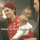 a woman in a red coat holds a baby in her arms with the words travel to new zealand below her