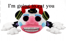 a stuffed clown with the words i 'm going to eat you written above it