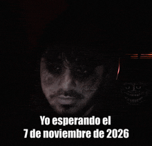 a black and white photo of a man with the words yo esperando el 7 de noviembre de 2026 below him