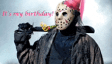 a man in a jason voorhees costume is holding a bat and wearing a pink party hat .