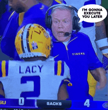 a man in a tigers jacket is talking to lacy