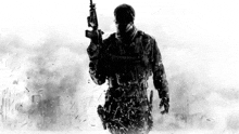 a black and white photo of a soldier holding a gun with the word army on his chest