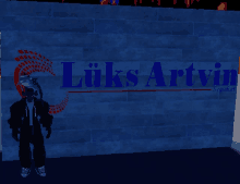 a man stands in front of a blue wall that says liks artvin