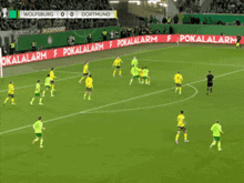 a soccer game between wolfsburg and dortmund with a score of 1-0