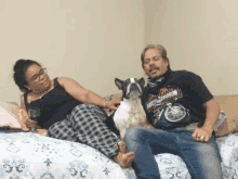 a man wearing a harley davidson shirt sits next to a woman