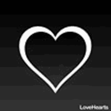 a white heart on a black background on a black background .