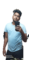 a man taking a selfie with a redmi note 8 camera