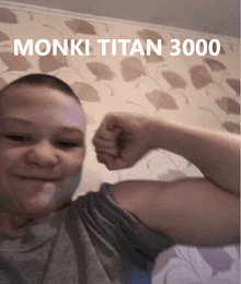 a man flexes his muscles in front of a wall with the words monki titan 3000 on it