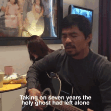 a man playing a guitar with the words taking on seven years the holy ghost had left alone