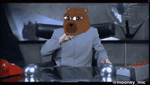 a man in a suit has a cartoon bear head on his head