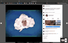 a computer screen shows a picture of a man 's face in a cloud