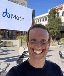 a man is taking a selfie in front of a large sign that says meth .