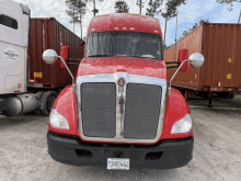 a red kenworth truck with a texas license plate p1007462