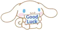 a cartoon bunny holding a sign that says " good luck "