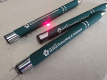 three green pens that say aha consulting and solutions