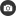 a black and white icon of a camera in a circle