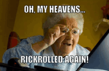 an elderly woman is looking at a computer screen with a meme that says oh my heavens rickrolled again