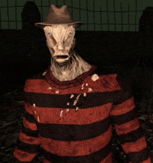 a nightmare before christmas character is wearing a striped sweater and a hat