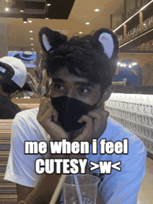 a man wearing a mask and cat ears says me when i feel cutsy > w <