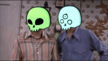 two men are standing next to each other with glowing skulls on their faces