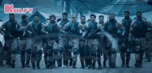 a group of soldiers are walking in a line and the words kulfy are on the bottom right