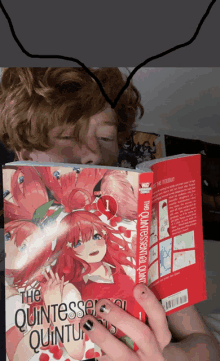 a person is reading the quintessential quintuplets manga