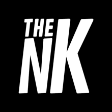 a white logo for the nk against a black background