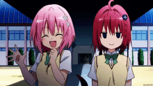 two anime girls one with pink hair and the other with red hair are standing next to each other in front of a building