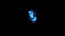 a glowing blue object is floating in the dark