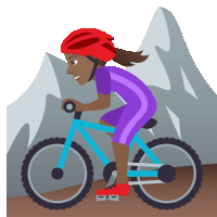 a woman wearing a helmet is riding a bike