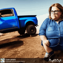 a picture of a woman kneeling in front of a blue truck with the name lizzie lahaina on the bottom