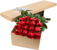 a cardboard box filled with red roses and a sticker that says ' i love you '