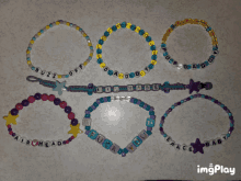 a bunch of bracelets with one that says " buzz off "