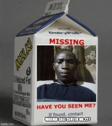 a carton of milk has a picture of a man on it .