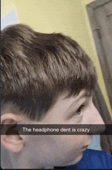 a boy with a headphone dent is crazy on his face