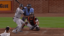 a new york baseball player swings at a pitch