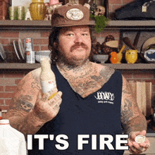 a tattooed man is holding a bottle of mayonnaise and a spoon and says it 's fire