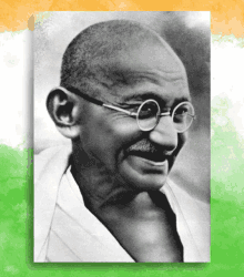 a black and white photo of mahatma gandhi with glasses on