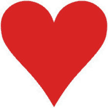 a red heart is sitting on a white surface .