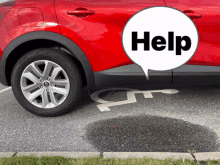 a red car is parked in a handicapped parking spot